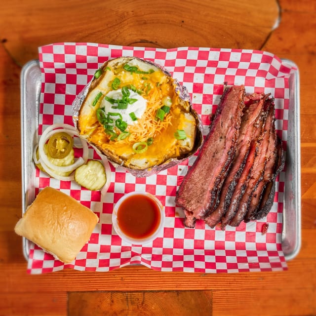 Sliced Brisket Plate with Baked Potato.